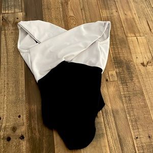 This is a black and white leotard from Five Dancewear. It is a size YXL.